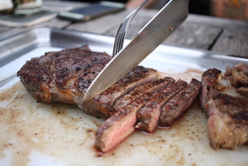 Someone slicing brisket.